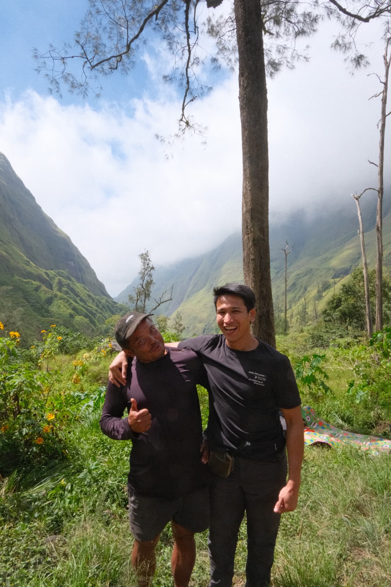 Zikry with a companion in a green mountain valley